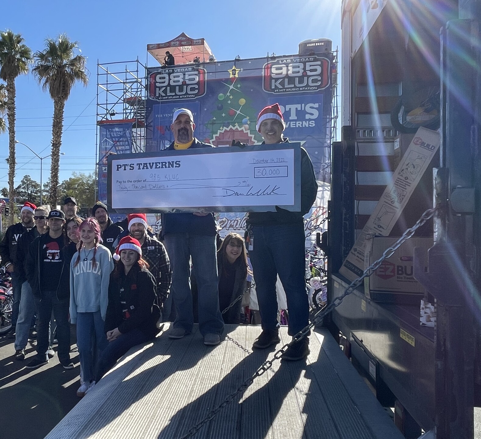 Photos of PT's Taverns donations to 98.5 KLUC annual toy drive